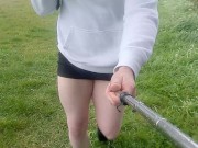 Crossdresser walks in the rain in tiny skirt