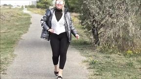 Big ass in black leggings walk in street