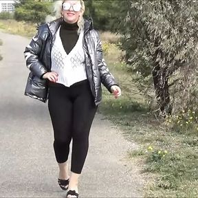 Big ass in black leggings walk in street