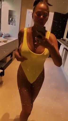 Celebrity Chrissy Teigen plays poker with her famous assets