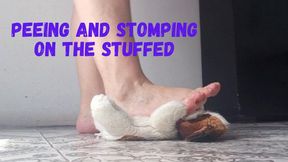 Peeing and stomping on the stuffed
