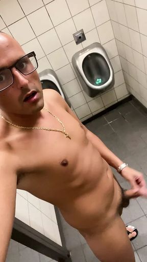 German twink masturbates naked on the toilet at the highway rest stop