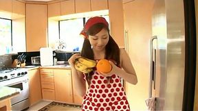 Young Japanese house wife Natsuko Tatsumi makes a fruit salad