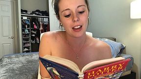 Good-looking babe reading Harry Potter book with vibrator in her tight pussy