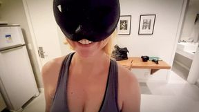 Masked blonde sucks cock kneeling and takes cumshot on her face.