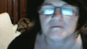 Ugly and fat webcam granny in glasses plays with her dirty cunt