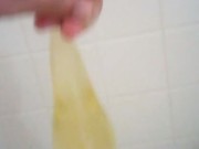 Playing with my piss filled rubber