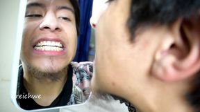 checking my teeth in the mirror