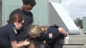 Busty cops take peeping tom to a rooftop when caught spying on white women