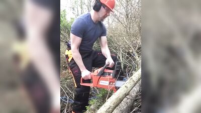 Muscly lumberjack takes his clothes off after work and strokes his cock