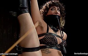 Hairy babe suspended by chains