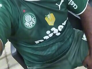 excited Palmeiras fan at the bus stop