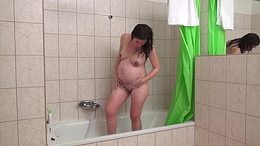 Pregnant brunette Ivett King has fun with a black guy on a white bed