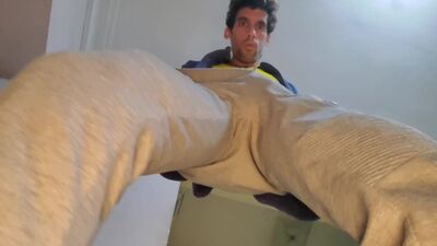 Hairy and athletic man takes a close up of his cock and balls