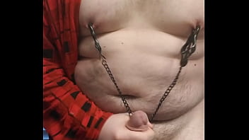 Fat boy rubbing cock any playing with nipple clamps