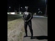 doubled cocked masked wetsuited guy jerking off outside