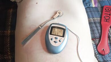 BDSM electro stimulation of dick in chastity belt, play with nipples.