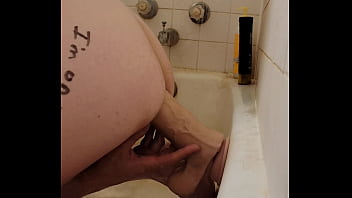 Riding a long thick dildo to orgasm