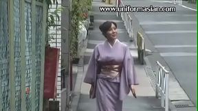 Mature Japanese woman in a kimono joins two guys for a wild threesome