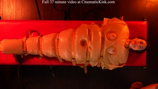 Isabel Love in inflatable latex sack