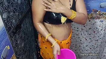 Indian Desi Bhabhi Bathing And Removing Her sexy saree.