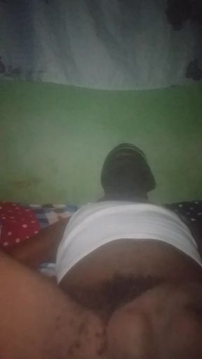 Flashing his big black ass.