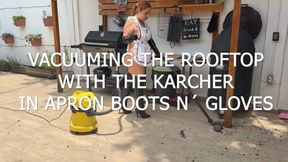 VACUUMING THE ROOFTOP WITH THE KARCHER IN APRON AND BOOTS