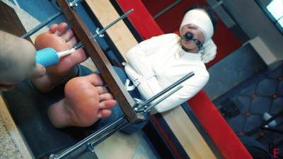 Mara's foot Tickling in special device in shirt and straight jacket