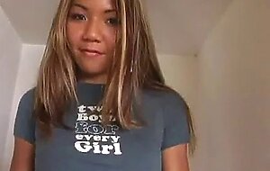 Keeani lei walks into the room wearing a shirt an