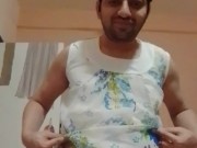Nude boy changing his clothes.