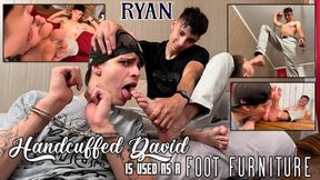 Ryan uses handcuffed David as his foot furniture for his long slim soles