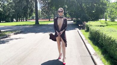 Stylish Lady walks naked in park. Public.