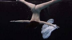 Sweet and special sexy redhead babe in white dress under water