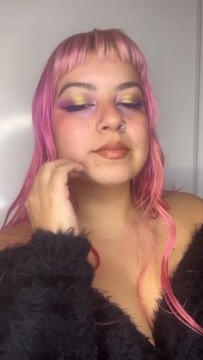 Brunette babe applies lipstick in makeup tutorial