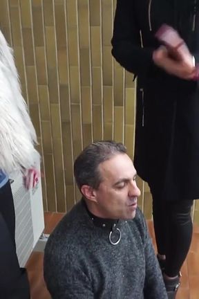 Fur-clad Femdoms Dominate Submissive on Balcony