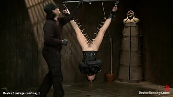 Brunette in upside down bondage