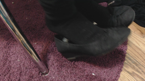 Dangling Black Shoes in Black Socks