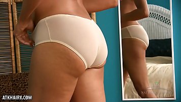 Mature Ebony woman, Ariel Grace took off her erotic lingerie and high heels to pose naked