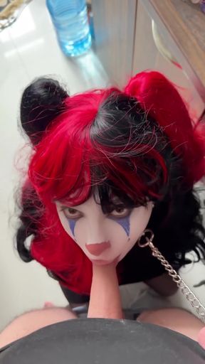 Clown with red hair and face paint