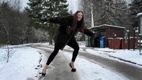 Girl on Heelless shoes walking on ice