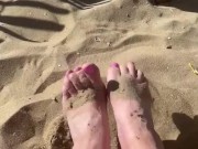 bare feet on a sandy beach