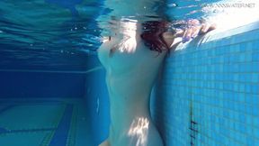 Big tits Sheril goes underwater naked