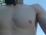 Completely, permanently hairless slave at a public nude beach
