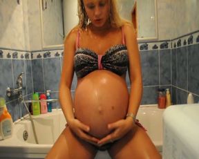 This pregnant babe is simply scrumptious and I love to watch her take a shower