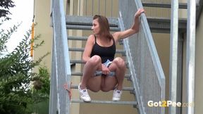 ”Fit Brunette Pees Down The Stairs”