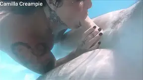 Hot older woman with large boobs gives underwater blowjob