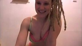 Blond haired girl with dreadlocks was playing with her dildo in the bathroom