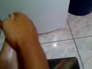 Oilying long blue toenails and feet