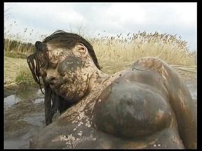 Chubby girl is getting screwed outdoors in the mud