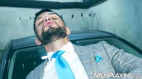 Suited Dan Tyser bends over for Oskar Ivans deep drilling